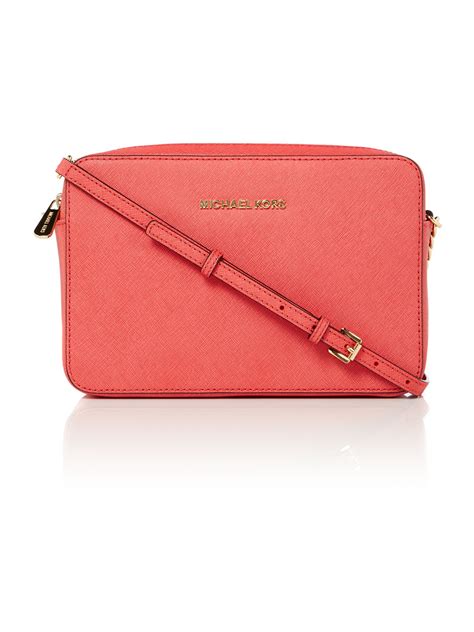 pink cross body bag michael kors|More.